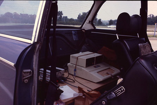 Softrek - Apple computer in car closeup